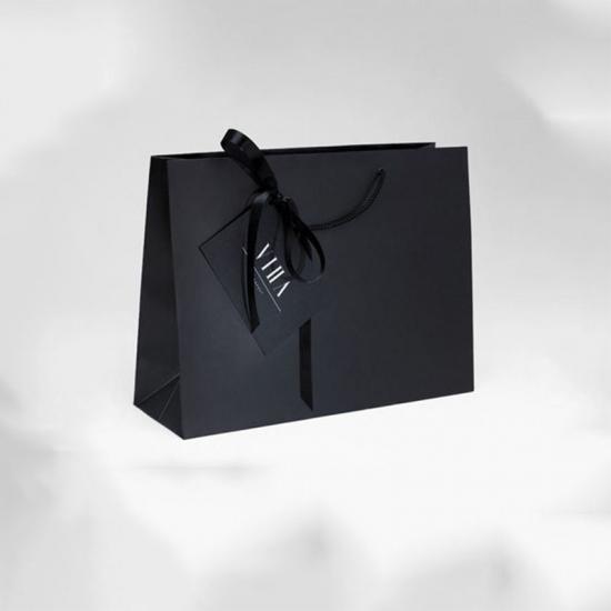 bolsa de compras de papel de regalo impresa personalizada de lujo con su propio logotipo y lazo 